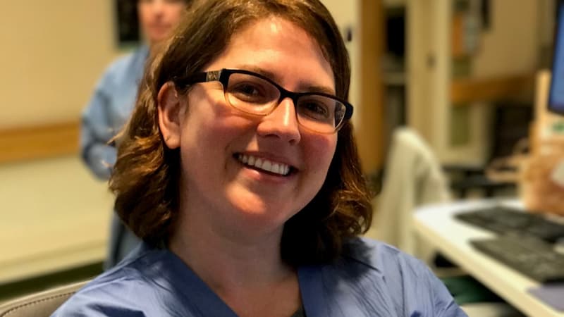 Woman smiling in scrubs